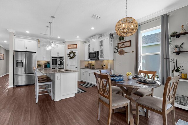 dining area with baseboards, visible vents, recessed lighting, and ornamental molding