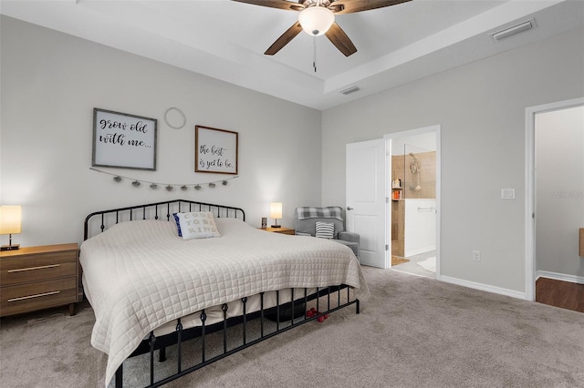 bedroom with carpet, visible vents, baseboards, and connected bathroom
