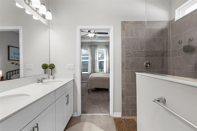 ensuite bathroom with ensuite bath, a healthy amount of sunlight, a sink, and a walk in shower