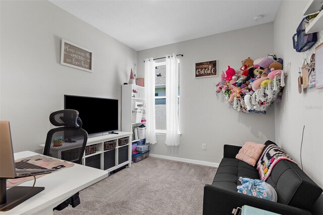 carpeted living room with baseboards