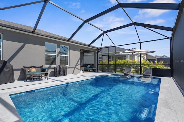 pool with a lanai, a grill, and a patio