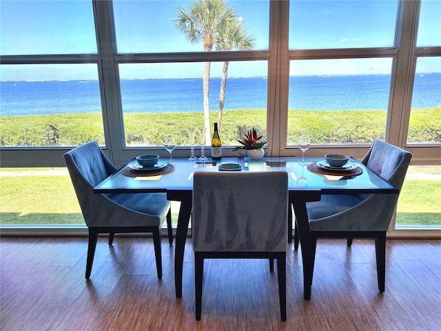 4800 Gulf Of Mexico Dr Unit 205, Longboat Key, FL 34228 - dining space with a water view and wood finished floors