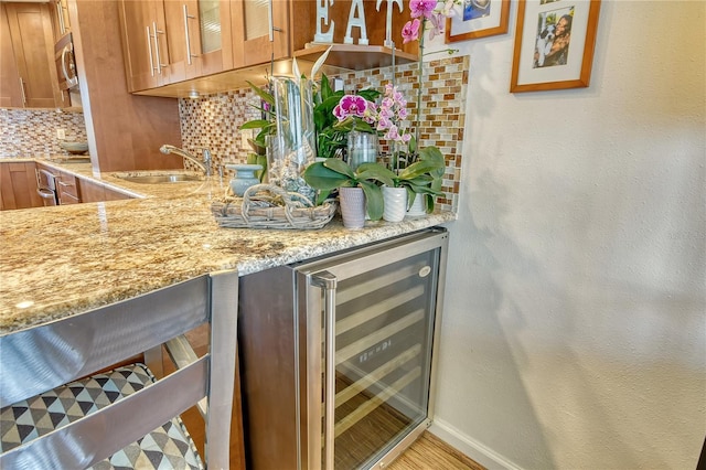 4800 Gulf Of Mexico Dr Unit 205, Longboat Key, FL 34228 - indoor bar featuring wine cooler, tasteful backsplash, and stainless steel microwave