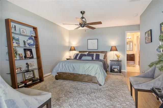 4800 Gulf Of Mexico Dr Unit 205, Longboat Key, FL 34228 - carpeted bedroom with connected bathroom and ceiling fan