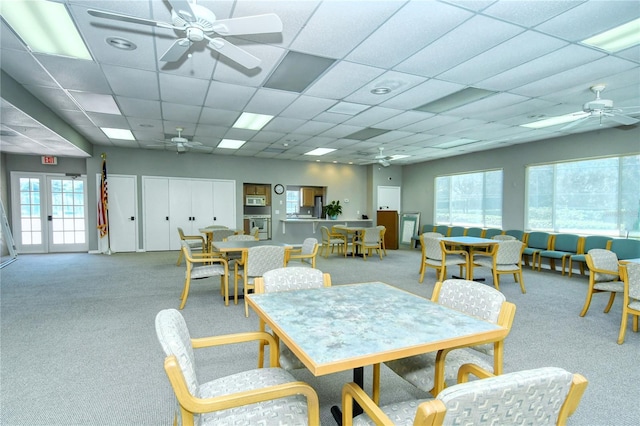 4800 Gulf Of Mexico Dr Unit 205, Longboat Key, FL 34228 - dining area with ceiling fan, carpet floors, and a paneled ceiling