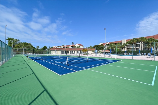 4800 Gulf Of Mexico Dr Unit 205, Longboat Key, FL 34228 - view of tennis court featuring community basketball court