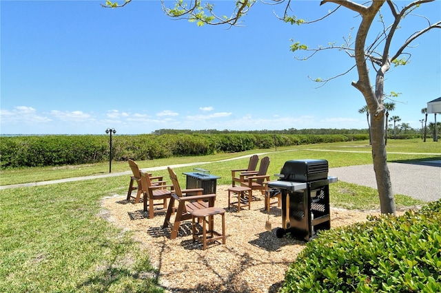 4800 Gulf Of Mexico Dr Unit 205, Longboat Key, FL 34228 - view of grassy yard featuring a fire pit