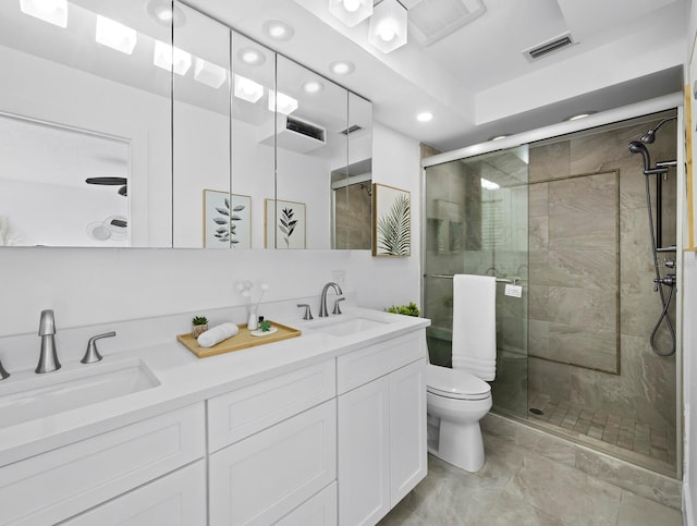 bathroom with a shower stall, recessed lighting, toilet, and double vanity