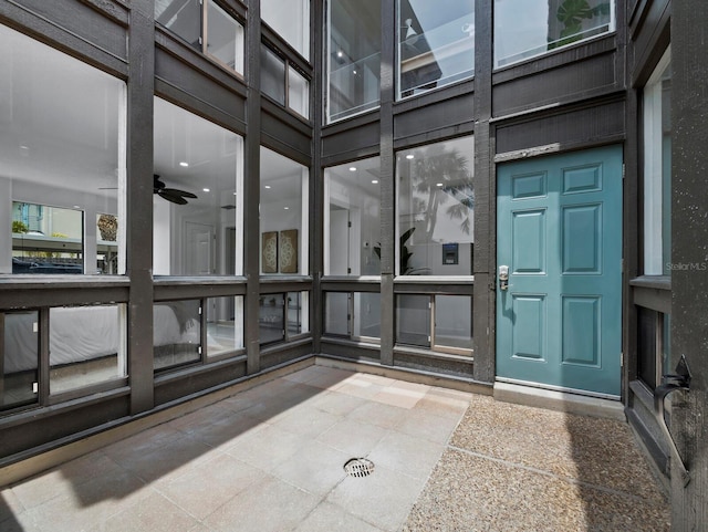 bathroom featuring a towering ceiling and ceiling fan