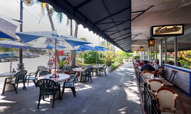 view of community with outdoor dining space