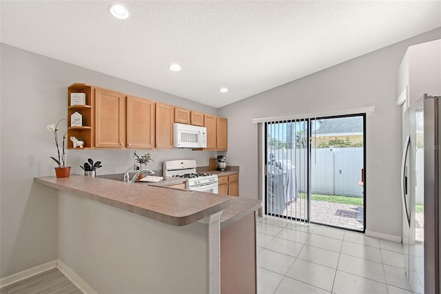 kitchen featuring a peninsula, open shelves, baseboards, white appliances, and recessed lighting