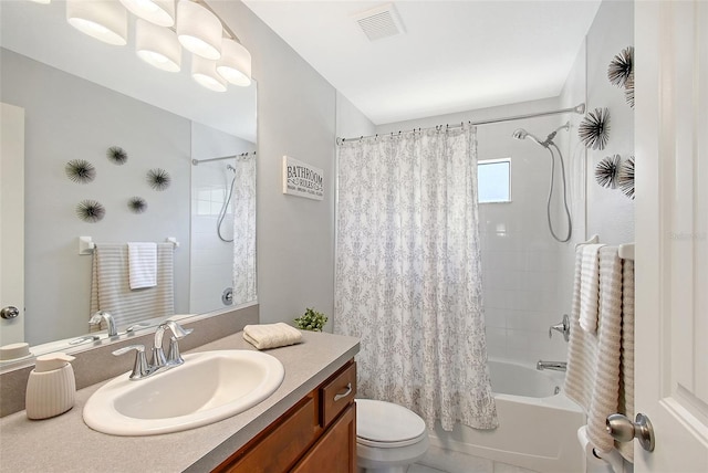 full bath with vanity, toilet, shower / bath combo with shower curtain, and visible vents
