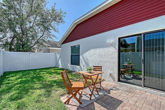 view of yard with a patio area and a fenced backyard