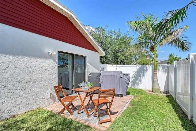 view of yard featuring a patio and fence