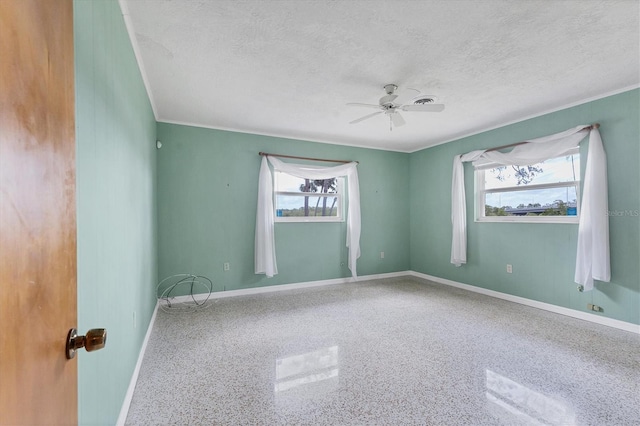 4311 52nd St E, Bradenton, FL 34208 - unfurnished room with baseboards, a textured ceiling, and a wealth of natural light