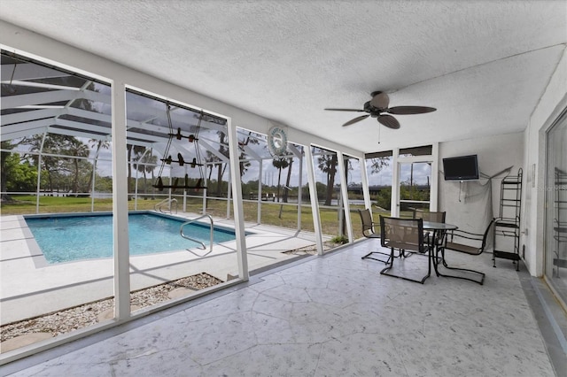4311 52nd St E, Bradenton, FL 34208 - outdoor pool with a ceiling fan, glass enclosure, and a patio area