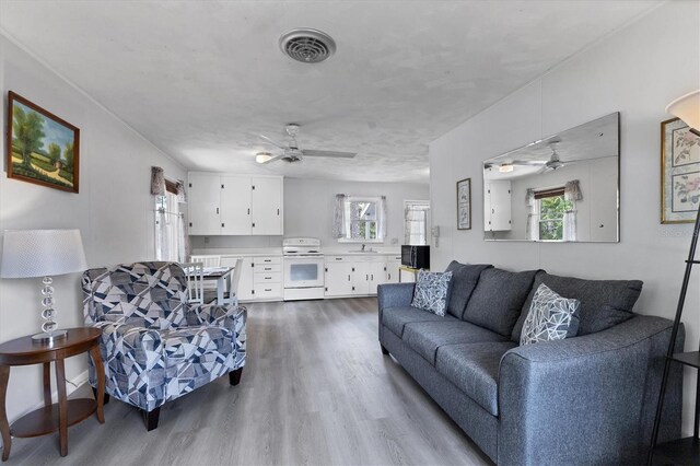 4311 52nd St E, Bradenton, FL 34208 - living area with ceiling fan, dark wood-style floors, and a wealth of natural light