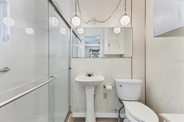 4311 52nd St E, Bradenton, FL 34208 - bathroom with a sink, a stall shower, and toilet