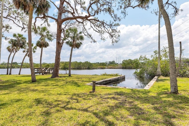 4311 52nd St E, Bradenton, FL 34208 - dock area featuring a lawn and a water view