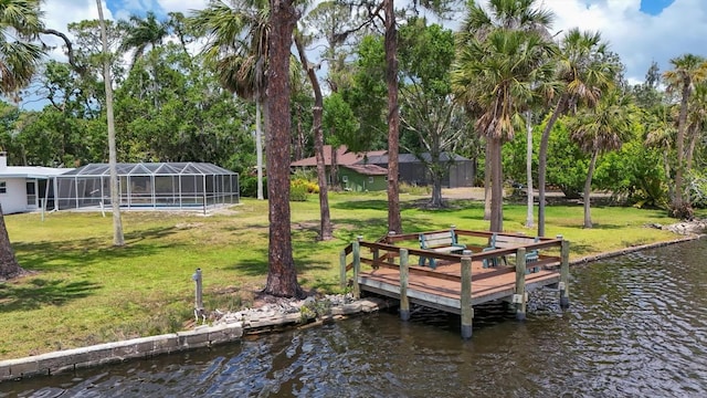 4311 52nd St E, Bradenton, FL 34208 - view of dock with a lawn, glass enclosure, and a water view