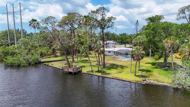 4311 52nd St E, Bradenton, FL 34208 - view of dock featuring a lawn, a water view, and a lanai
