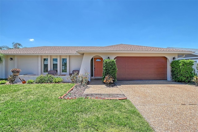 4609 Talbot Pl, Sarasota, FL 34241 - ranch-style house featuring stucco siding, an attached garage, driveway, and a front yard