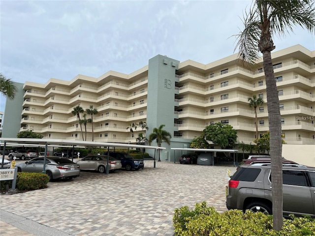 5780 Midnight Pass Rd Unit 410, Sarasota, FL 34242 - view of building exterior featuring covered parking