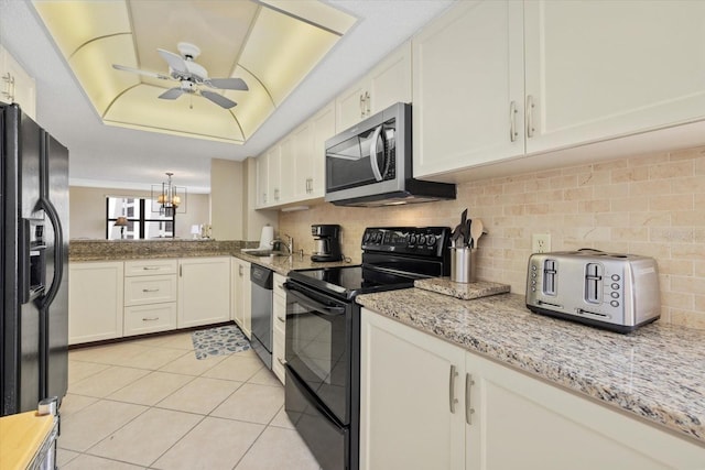 5780 Midnight Pass Rd Unit 410, Sarasota, FL 34242 - kitchen featuring tasteful backsplash, light stone countertops, a sink, ceiling fan with notable chandelier, and black appliances