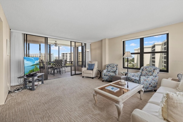 5780 Midnight Pass Rd Unit 410, Sarasota, FL 34242 - living room with a wall of windows, carpet flooring, and a textured ceiling