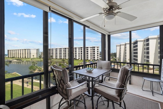 5780 Midnight Pass Rd Unit 410, Sarasota, FL 34242 - sunroom with tile patterned flooring, a water view, and ceiling fan