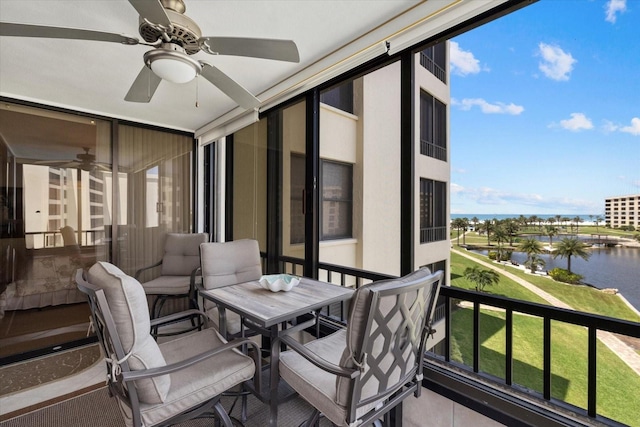5780 Midnight Pass Rd Unit 410, Sarasota, FL 34242 - balcony featuring a water view and ceiling fan