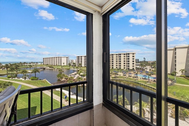 5780 Midnight Pass Rd Unit 410, Sarasota, FL 34242 - sunroom / solarium with a water view