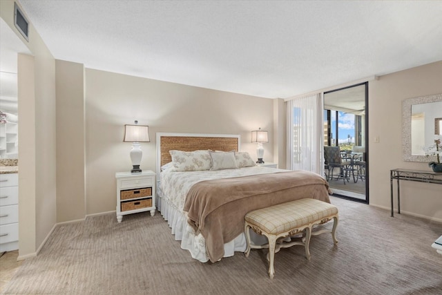 5780 Midnight Pass Rd Unit 410, Sarasota, FL 34242 - bedroom with baseboards, access to outside, visible vents, and light colored carpet