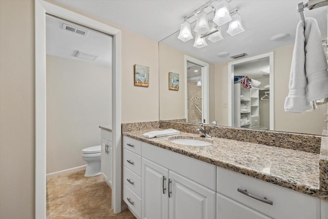 5780 Midnight Pass Rd Unit 410, Sarasota, FL 34242 - full bath featuring visible vents, a walk in closet, toilet, and vanity