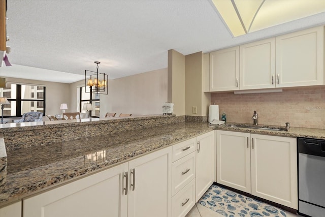 5780 Midnight Pass Rd Unit 410, Sarasota, FL 34242 - kitchen with a sink, tasteful backsplash, stainless steel dishwasher, and stone countertops