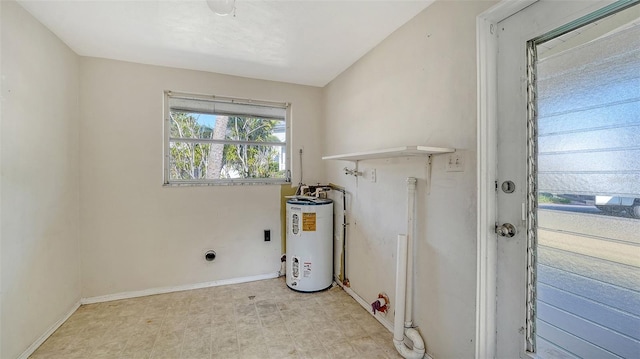 laundry room featuring laundry area, water heater, baseboards, electric dryer hookup, and light floors