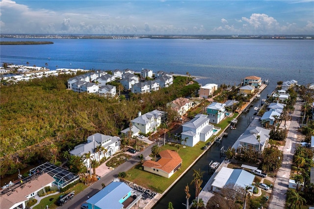 bird's eye view with a water view and a residential view