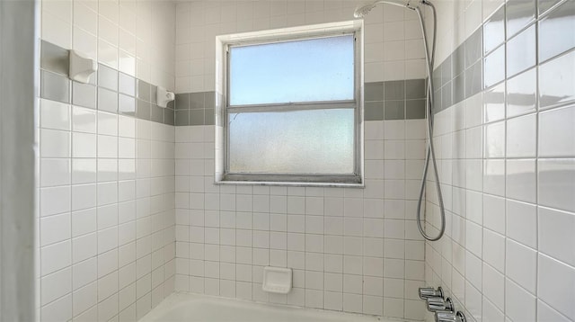 bathroom featuring  shower combination