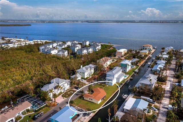 aerial view with a water view and a residential view