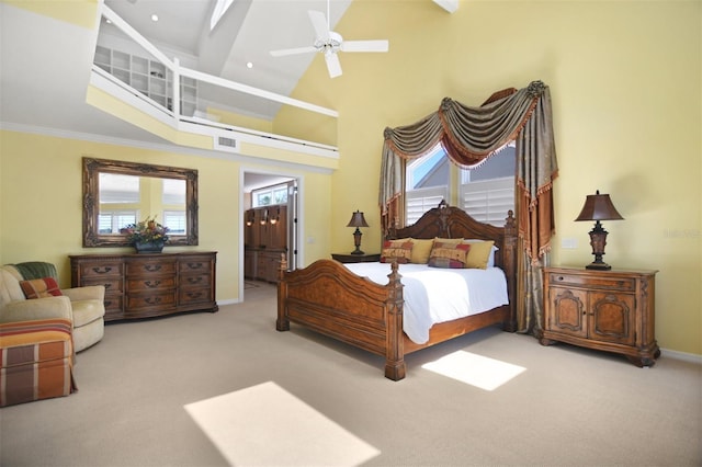 bedroom featuring ceiling fan, visible vents, carpet floors, baseboards, and high vaulted ceiling
