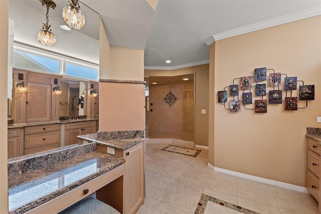 full bathroom with a tile shower, vanity, tile patterned floors, baseboards, and ornamental molding