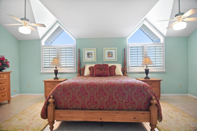 bedroom with baseboards, multiple windows, and vaulted ceiling