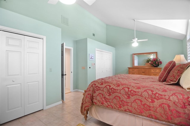 bedroom featuring light tile patterned flooring, ceiling fan, high vaulted ceiling, baseboards, and visible vents