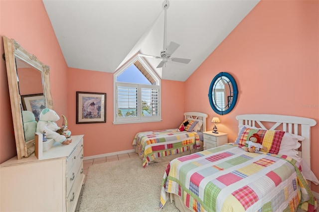 tiled bedroom with ceiling fan, baseboards, and lofted ceiling