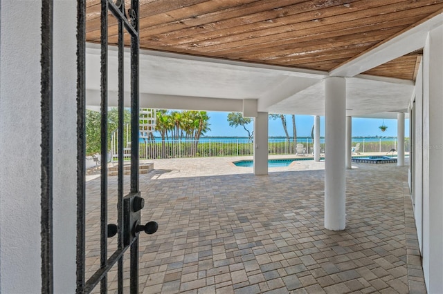 view of patio with a fenced in pool and fence