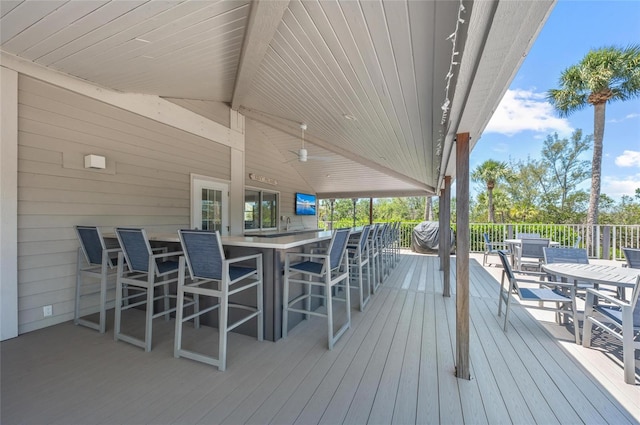 wooden deck featuring a bar