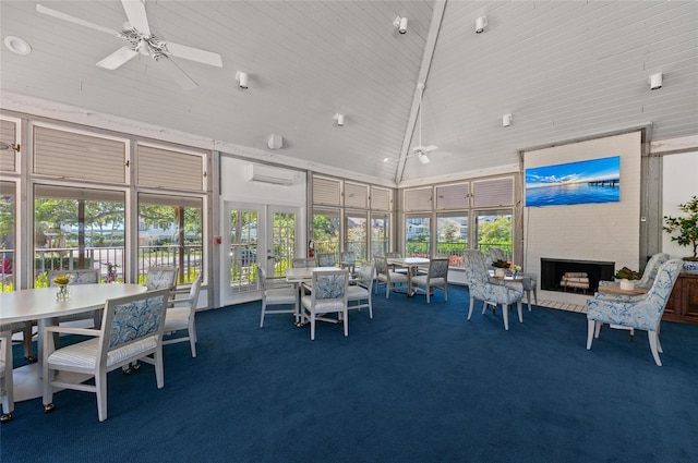 sunroom / solarium with high vaulted ceiling, a wall mounted AC, and carpet flooring