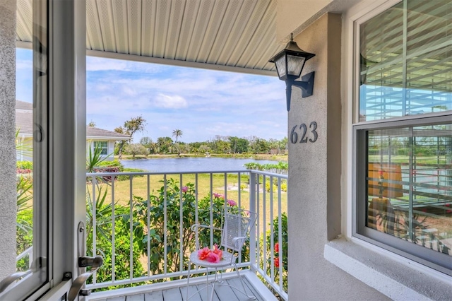 balcony featuring a water view