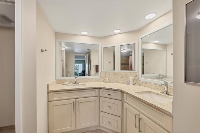 bathroom with double vanity and a sink