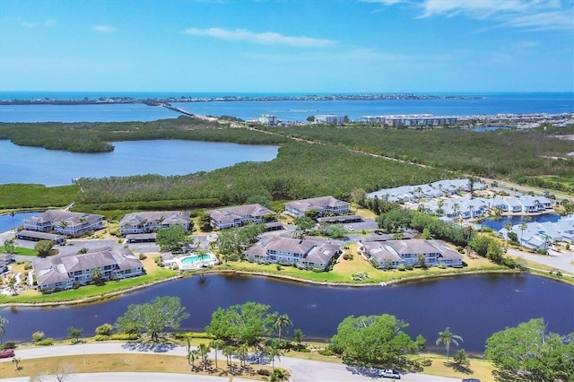 birds eye view of property with a residential view and a water view